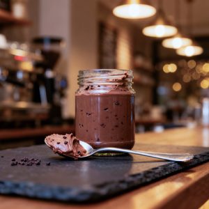 a jar of homemade cacao nib crunch butter